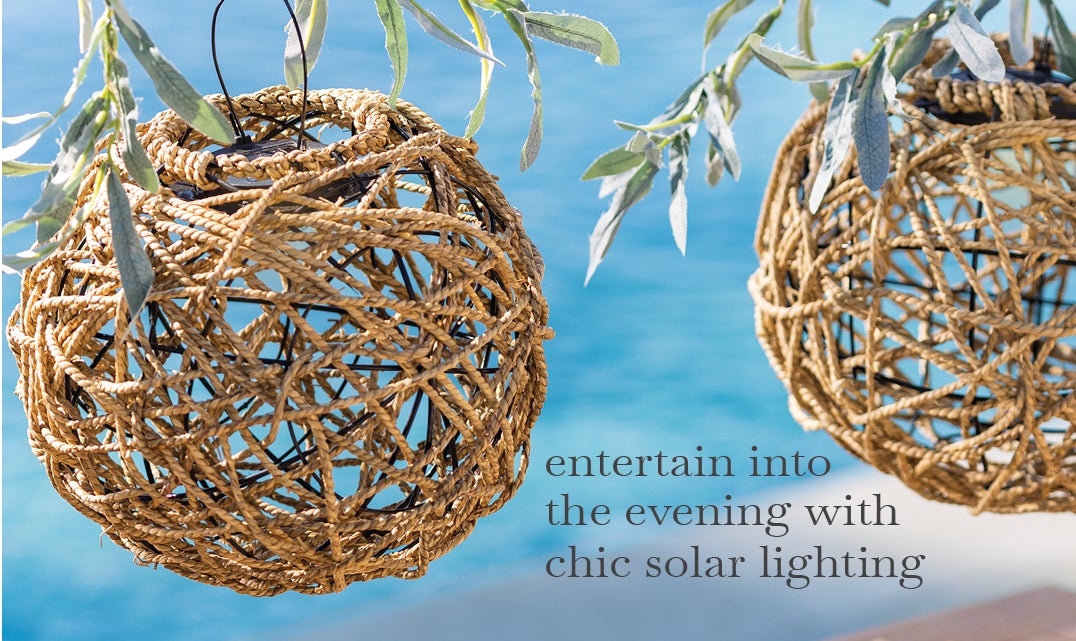 image of Seagrass Solar Lantern hanging from tree. entertain into the evening with chic solar lighting.