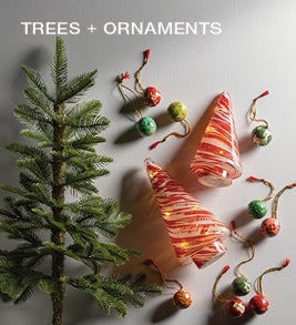 Image of small pine tree and paper mache ornaments. Shop tabletop décor.