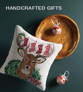 Image of a hand-hooked holiday pillow, handcrafted tray and hand-painted ornaments. Shop Handcrafted Gifts.