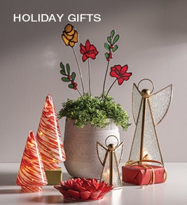 Image of glass holiday angels and trees and glass holiday garden stakes. Shop Holiday Gifts.