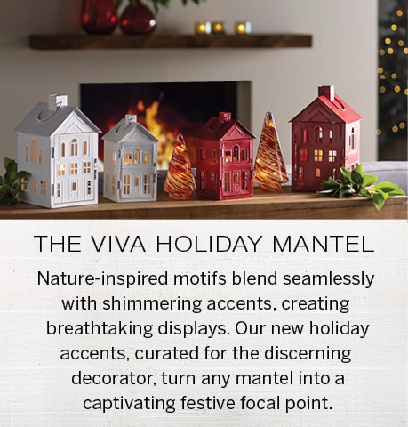 Image of lighted glass trees and metal house lanterns in red and white on a mantel. THE VIVA HOLIDAY MANTEL: Nature-inspired motifs blend seamlessly with shimmering accents, creating breathtaking displays. Our new holiday accents, curated for the discerning decorator, turn any mantel into a captivating festive focal point.