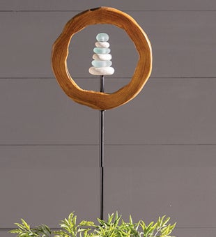 Image of Teak Wood Encircled Glass and Rock Cairn Garden Stake