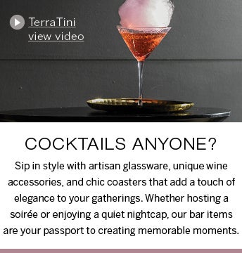 Image of TerraTini cocktail in martini glass with cotton candy atop. Cocktails anyone? Sip in style with artisan glassware, unique wine accessories, and chic coasters that add a touch of elegance to your gatherings. Whether hosting a soirée or enjoying a quiet nightcap, our bar items are your passport to creating memorable moments. View Video