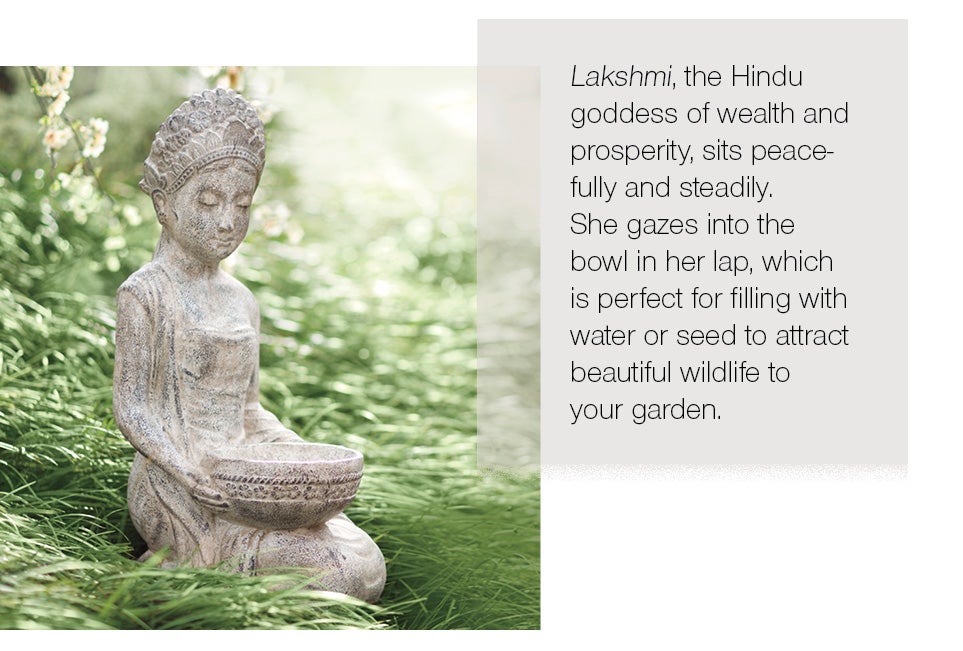 Lakshmi, the Hindu goddess of wealth and prosperity, sits peacefully and steadily. She gazes into the bowl in her lap, which is perfect for filling with water or seed to attract beautiful wildlife to your garden.