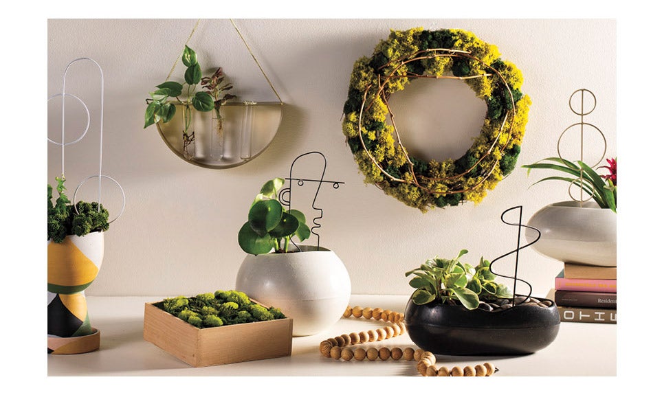 Open and Globe shaped rolled stone planters with Zen Moss Wreath on wall 