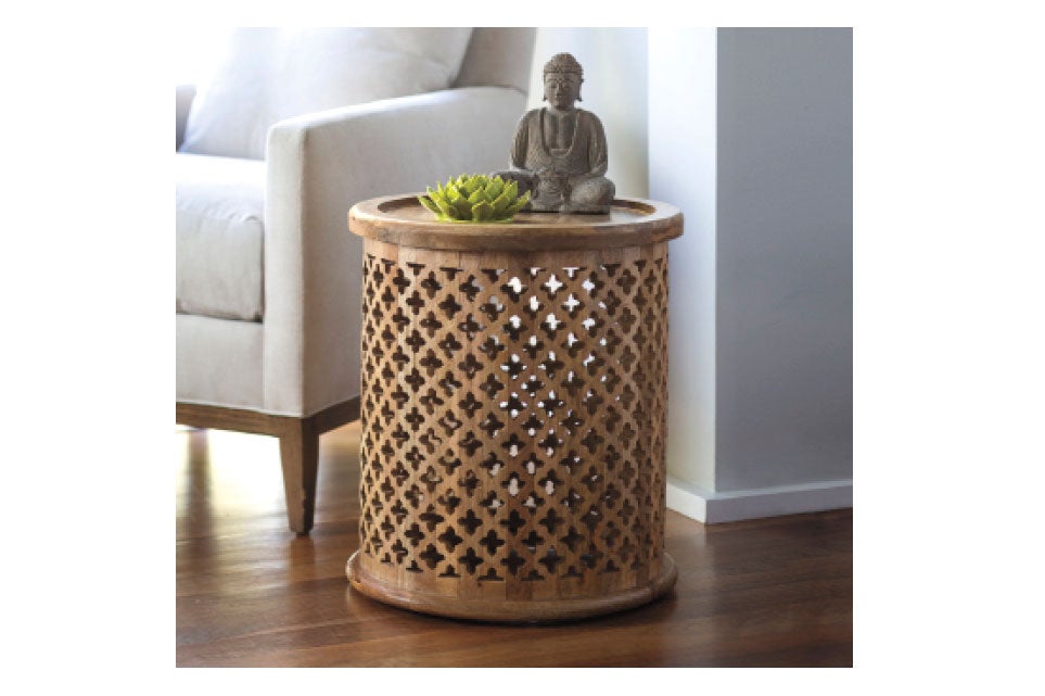 Buddha status and ceramic flower on Carved Moroccan Side Table